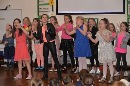 Schoolchildren sing Sixties hits for music competition