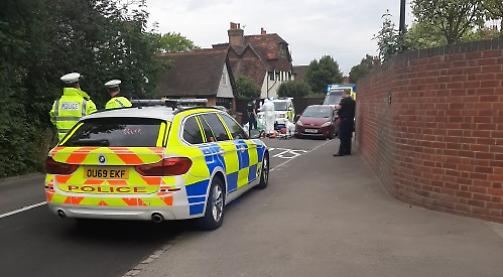 Woman arrested after cyclist dies in crash