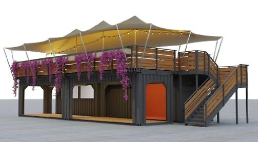 Shipping containers lifted into place for pop-up restaurant