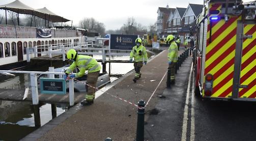Truck crashes through bollards into river