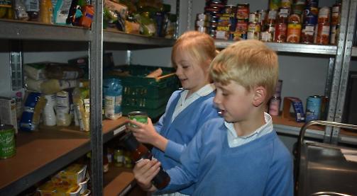 Children deliver 30 bags of donated food