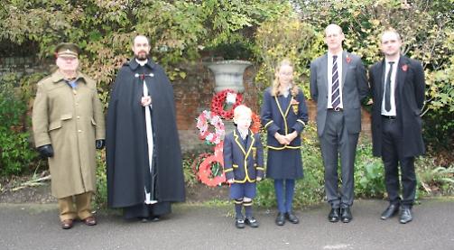 Children remember with poems and wreaths