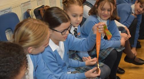 Work hard to succeed, rowing champion tells children
