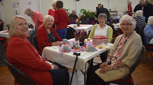 WI celebrate meeting with a royal theme