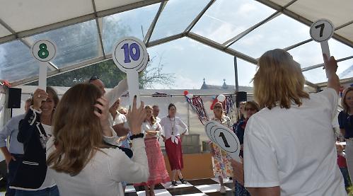 Villagers come together for celebration picnic, games and dancing contest