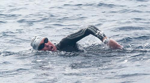 Man becomes oldest Briton to swim notorious sea strait