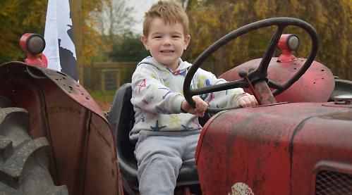 Tractors take people to farm service