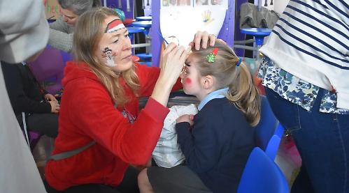 Pupils race pigs and throw snowballs at Christmas fair