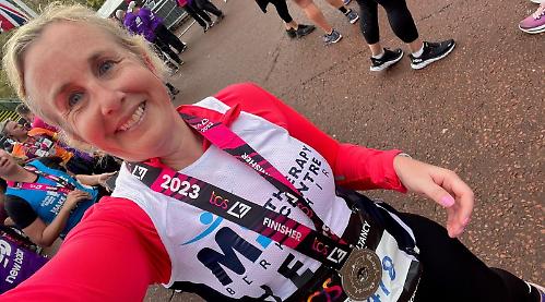 Charity runners finish London Marathon despite pain and rain