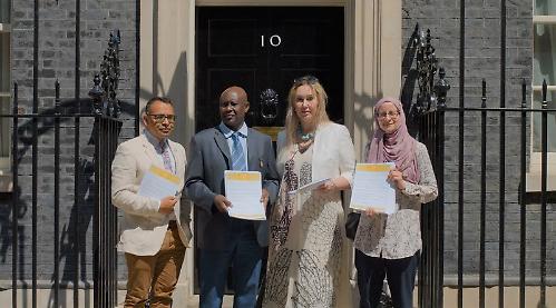 Campaigner helps deliver Sudanese refugees petition to Downing Street