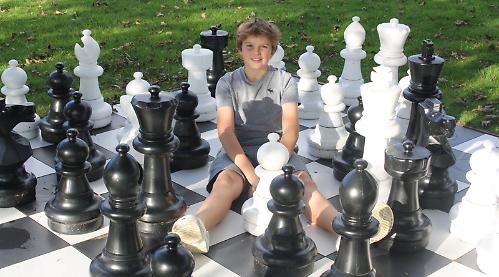 Children’s chess teacher, aged 12