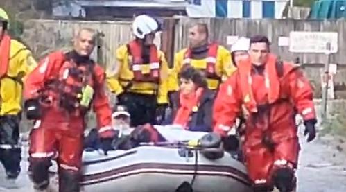 Elderly couple rescued from home by firefighters on flooding drama
