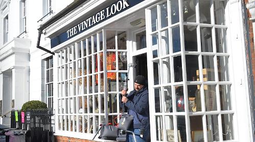 Silence please: passers-by witness TV crime drama being filmed at shop