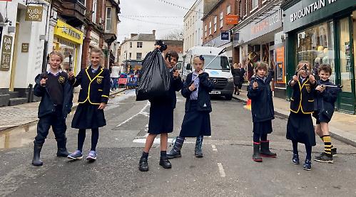 Pupils go litter picking while street is shut for repairs