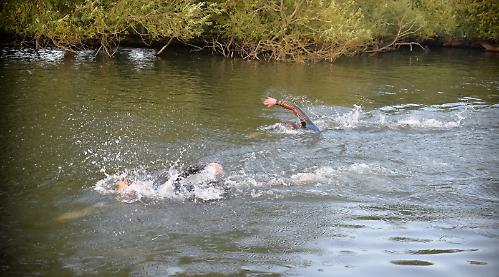 Team-mates take top three places at club to pub swim