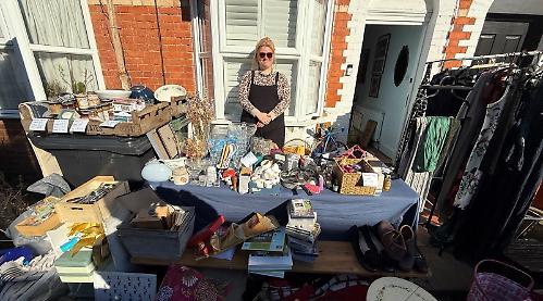 Neighbours hold sale outside their homes