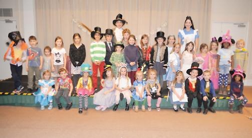 Children dress up for Alice in Wonderland themed party