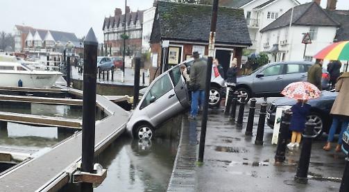 Elderly woman rescued after accidentally driving into river
