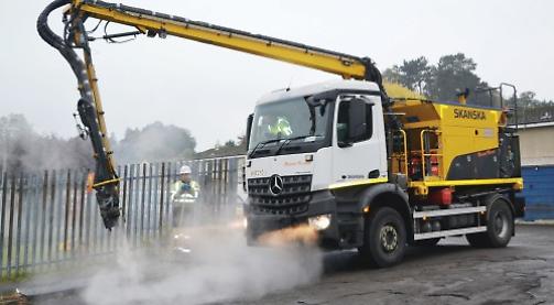 Pothole repair machine left sticky tar all over car