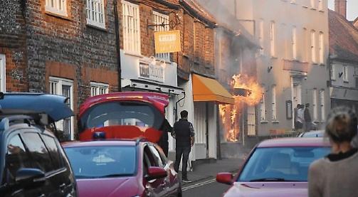 Couple escape as blaze rips through shop next to home