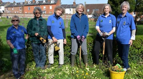 Volunteers tidy up church's overgrown millennium garden