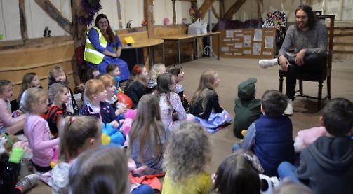 Brand gives reading to children during May Fayre