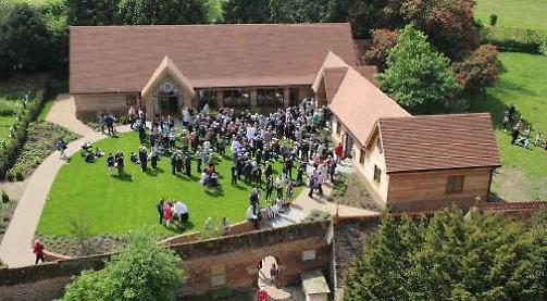 Mrs May takes time off to open village church and community hall