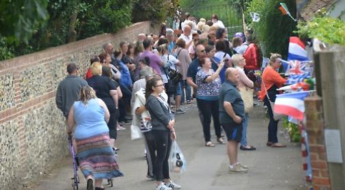 Thousands flock to village to mark George Michael's birthday