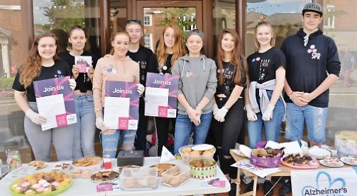 Teenagers stage charity cake sale for citizenship scheme