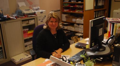 Town manager to stay despite cut in funding by district council