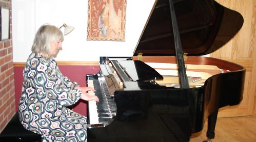 Woman achieves highest award for playing piano