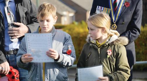 Pupils pay tribute with poetry and poppy crosses