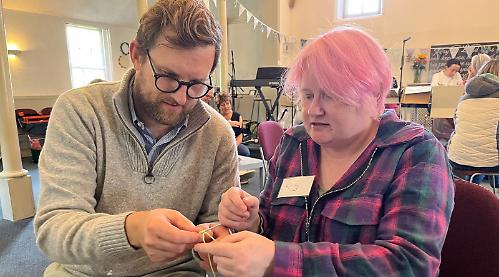 MP (and family) in knitting workshop at cafe