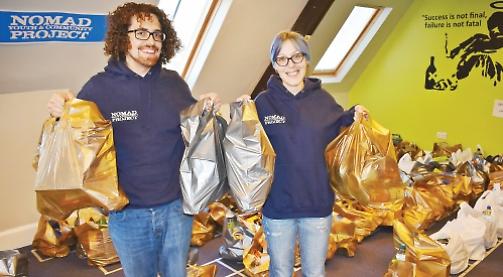 Charity hands out food parcels to needy