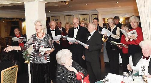 Christmas carol singers raise £2,000 for air ambulance