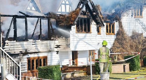Firefighters save £2.8m house on river in thatched roof blaze