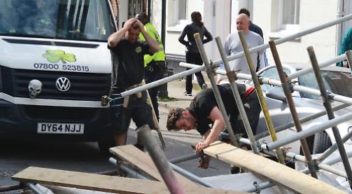 Workman escapes as scaffolding collapses