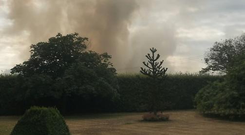 Eight fire crews battle field blaze