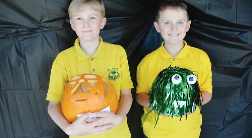 Pupils decorate pumpkins for Halloween disco night