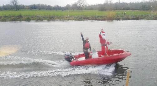 Santa arrives for lunch by boat