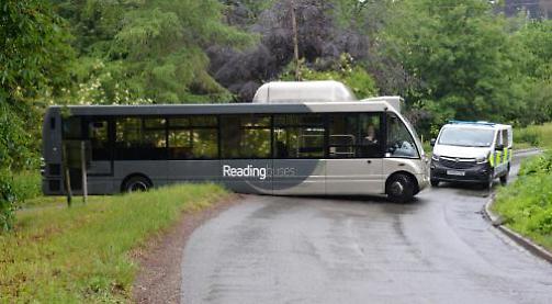 Road shut as bus runs aground