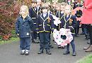 Children remember with poems and wreaths
