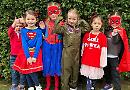 Comic Relief: schoolchildren (and teachers) wear fancy dress and put on red noses