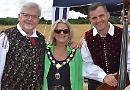 Friends make song and dance in field