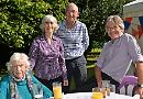 Care home residents enjoy party with families