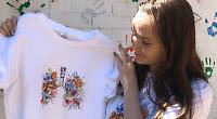 Girl sells virus design T-shirts