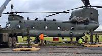 RAF helicopter stuck in muddy field after forced landing