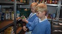 Children deliver 30 bags of donated food