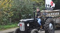 Tractors take people to farm service