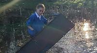 Students clear pond in school grounds to help wildlife